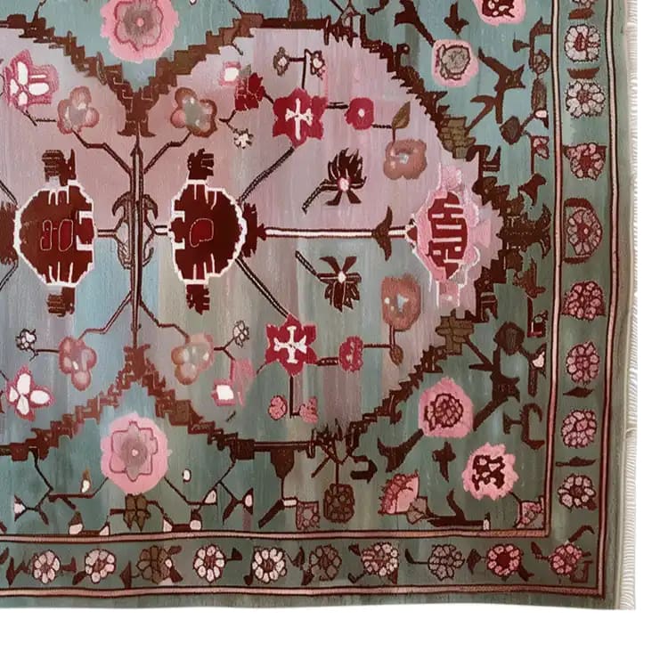 A beautifully detailed area rug featuring intricate floral patterns in pink and green hues. This knotted wool rug is perfect for adding a touch of elegance to your living room. Ideal for an 8x10 space, it combines traditional design with modern style, making it a standout piece among living room rugs.