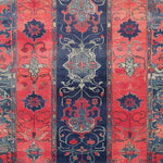This vibrant area rug showcases a stunning floral pattern with rich red and deep blue hues, perfect for adding elegance to any living room. The hand-tufted wool design offers a luxurious texture, making it an ideal choice for living room area rugs. Its 8x10 size makes it a versatile option for various spaces.