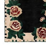 Elegant Rosette Noir hand-tufted area rug featuring intricate floral designs with bold red roses and green leaves on a black background. Perfect as a wool rug for living room or office spaces, adding a touch of sophistication and style.