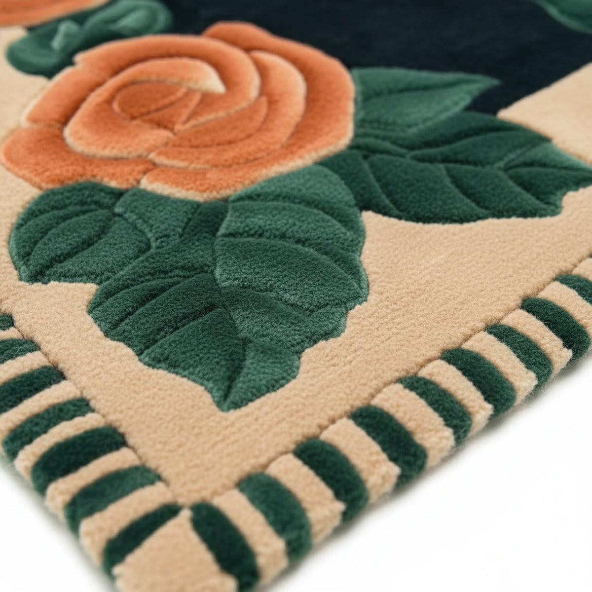 Close-up of a textured rug with floral design featuring a rose and leaves.