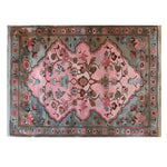 The Rosie Reverie Knotted Wool Rug is an elegant area rug featuring a vibrant floral design. This rug is perfect for adding a touch of sophistication to living rooms, with its intricate patterns and rich colors.