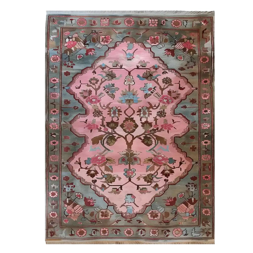 The Rosie Reverie Knotted Wool Rug is a stunning area rug featuring a vibrant floral design. Perfect for adding a touch of elegance to any living room, this rug showcases intricate patterns in pink and blue tones, making it a standout piece among area rugs for living room decor.