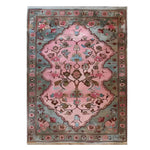 The Rosie Reverie Knotted Wool Rug is a stunning area rug featuring a vibrant floral design. Perfect for adding a touch of elegance to any living room, this rug showcases intricate patterns in pink and blue tones, making it a standout piece among area rugs for living room decor.