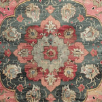 A close-up view of the Rosy Heritage Hand Tufted Rug, showcasing an intricate vintage Persian design. The wool rug features bold red and muted green tones, ideal as a square area rug under a dining table or as a statement piece in a dining room or office. Perfect for those seeking a classic touch with dining room carpets.