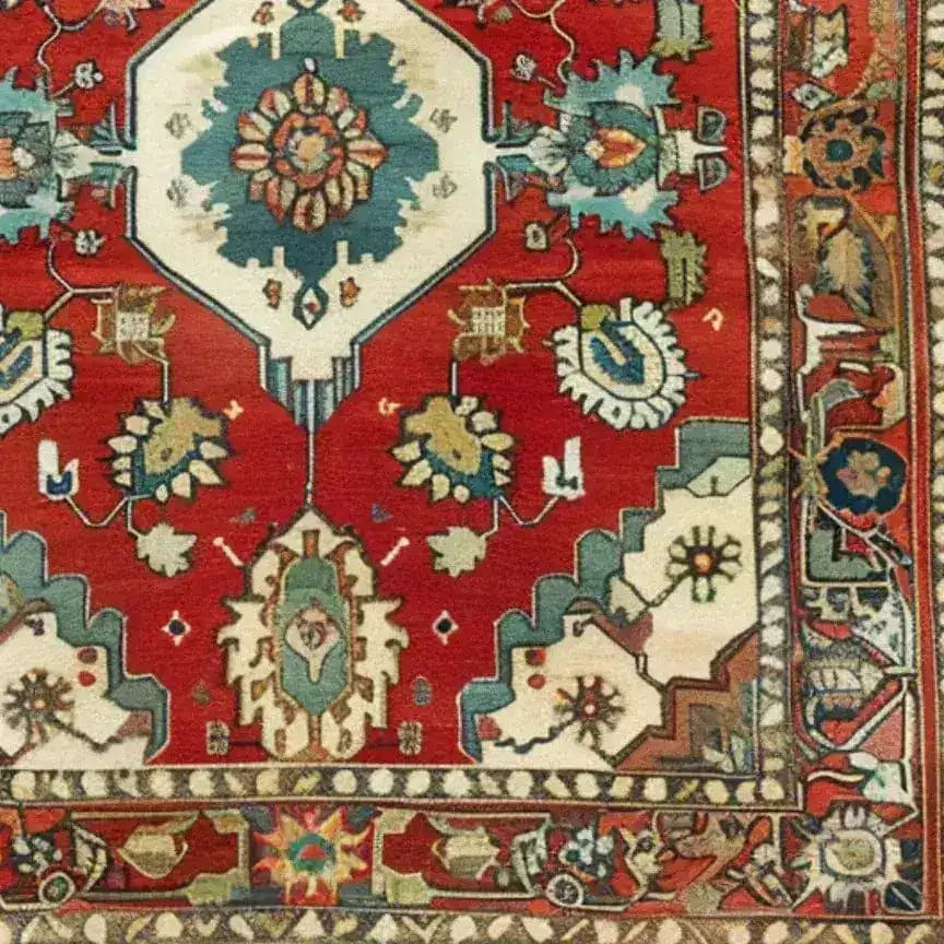 A vibrant Rosy Retreat Hand Knotted Area Rug showcasing intricate Persian-inspired patterns in rich red, blue, and cream tones. This vintage rug features floral and geometric designs, perfect for adding a touch of elegance to large living room spaces.