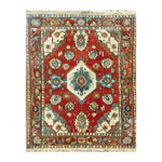 Top view of the Rosy Retreat Hand Knotted Area Rug, a stunning vintage rug featuring intricate Persian designs in vibrant red, blue, and ivory. Perfect for large living rooms, this elegant rug enhances any space with its timeless beauty.