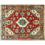 A vibrant Rosy Retreat hand knotted area rug featuring a traditional Persian design. This large living room rug showcases intricate floral patterns with rich red, blue, and cream colors, embodying a vintage rug charm perfect for enhancing your home decor.