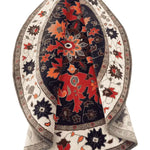 This vibrant area rug features a striking round medallion design with intricate floral patterns, perfect for adding a touch of elegance to any bedroom. Crafted from high-quality wool, this Persian-style round rug showcases rich hues of red, orange, and navy, making it a stunning centerpiece among bedroom area rugs.