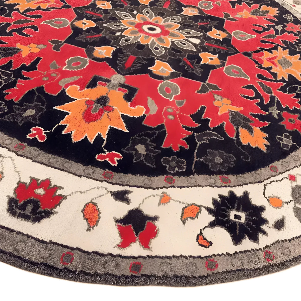 Vibrant round area rug featuring an intricate medallion design with red, orange, and black hues, perfect for enhancing bedroom decor. This wool rug, reminiscent of Persian rugs, adds a touch of elegance and warmth to any bedroom space.