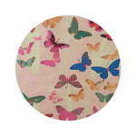 round rug covered in colorful butterflies in pink blue green and gold on cream pink background flat view