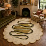 A large scalloped area rug in a styled living room, featuring a prominent black and gold snake design on a cream background.