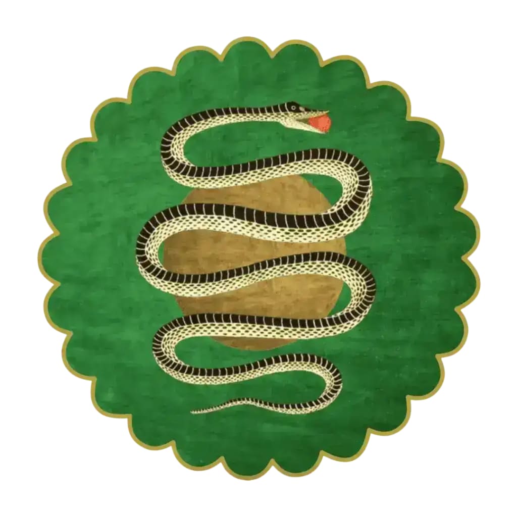 Round scalloped green snake rug with a black-and-cream striped serpent coiled over a golden apple, top view