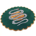 Round scalloped wool rug, dark green with gold border, coiled black-and-white snake over gold orb