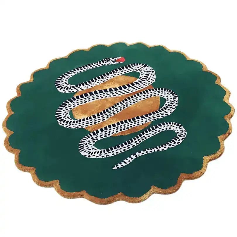 Round scalloped wool rug, dark green with gold border, coiled black-and-white snake over gold orb