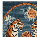 Close-up view of the Royal Duel Hand Tufted Rug featuring a vibrant floral and tiger design. This wool rug combines vintage aesthetics with modern flair, perfect for an 8x10 living room area. The intricate pattern and rich colors make it a standout piece among living room area rugs.