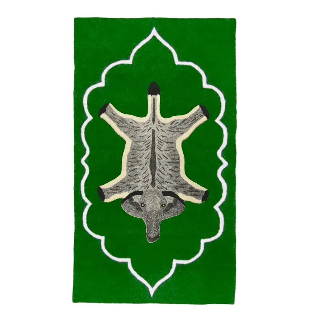 Vibrant green Royal Elephant Hand Tufted Wool Rug showcasing a vintage design, ideal for bedroom area rugs or office settings. The intricate elephant motif adds a touch of elegance to any space, making it a perfect wool rug choice for both bedroom and office environments.