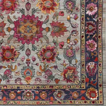 Close-up view of the Royal Flower Tapestry Hand Knotted Area Rug, showcasing its intricate floral patterns in vibrant colors. This square area rug features a vintage and Persian-inspired design, made from high-quality wool. It's an ideal large area rug for living room spaces, adding a touch of elegance and warmth.