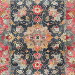Top view of a Royal Majesty Hand Tufted Area Rug featuring intricate floral patterns in vibrant reds, oranges, and grays. This wool rug is perfect for a dining room, large living room, or formal dining room. Its Persian-inspired design adds elegance and style to any space.