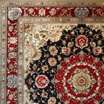 Detailed view of a Royal Persian Hand Knotted Area Rug featuring an intricate floral pattern with rich red, black, and beige tones. Perfect for adding a vintage touch to dining or living rooms, this square rug is crafted from high-quality wool, showcasing traditional Persian design elements ideal for dining room area rugs.