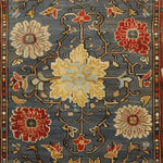 Close-up view of a Rustic Elegance Hand Knotted Area Rug featuring a vintage floral pattern. This Persian-style rug showcases intricate designs with red, beige, and blue hues, making it a perfect addition to living room area rugs or as a centerpiece in rugs for living room collections.