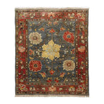 A stunning Rustic Elegance Hand Knotted Area Rug showcasing a vintage Persian design. This living room area rug features a bold floral pattern with vibrant red, blue, and yellow hues, perfect for adding a touch of classic charm to any space.