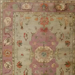 A beautifully crafted Rustic Heritage Hand Knotted Area Rug featuring intricate vintage designs. The rug showcases a harmonious blend of soft pastel colors, with floral and ornate patterns typical of Persian rugs, perfect for adding elegance to any living room.