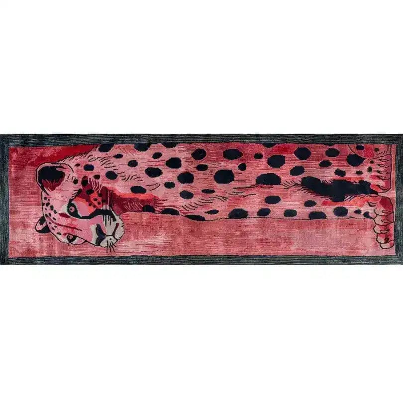 A vibrant Safari Streak hand tufted wool runner rug featuring an abstract leopard design in deep red and black tones. Ideal for adding a contemporary touch to your hallway, living room, or kitchen. Perfect as a hallway runner rug or as a standout piece among large living room rugs. This eye-catching wool rug is also suitable as a kitchen runner rug or bathroom runner rug, offering both style and durability.