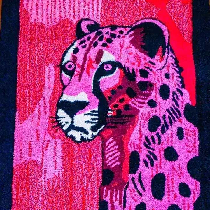 Vibrant Safari Streak Hand Tufted Wool Runner Rug featuring an abstract depiction of a tiger in rich pink and red hues. Perfect for adding a bold statement to your living room or hallway. This contemporary area rug, crafted from high-quality wool, serves as a stunning kitchen runner or a striking addition to any modern space, blending art with functionality.