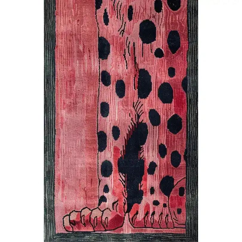 A vibrant Safari Streak hand-tufted wool runner rug featuring an abstract design with bold black spots on a rich pink background, perfect for adding a contemporary touch to your living room or hallway. Ideal as a hallway runner rug or a stylish addition to your kitchen, this wool rug combines durability with modern aesthetics.