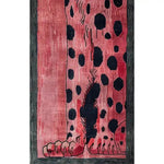 A vibrant Safari Streak hand-tufted wool runner rug featuring an abstract design with bold black spots on a rich pink background, perfect for adding a contemporary touch to your living room or hallway. Ideal as a hallway runner rug or a stylish addition to your kitchen, this wool rug combines durability with modern aesthetics.