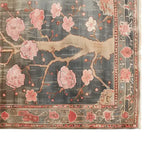A stunning area rug with a floral design, showcasing delicate pink cherry blossoms on a soft, muted background. This Sakura Serenity Knotted Wool Rug is perfect for adding elegance to any living room. Sized 8x10, it's an ideal choice for those seeking beautiful area rugs for their living space.