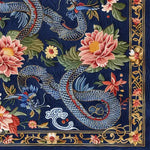Vibrant hand-tufted wool area rug featuring an intricate design with colorful flowers and a dragon motif on a rich navy background. Perfect as a dining table rug or a square area rug for the living room, this vintage-inspired rug adds a touch of elegance to any dining room or living space.