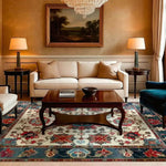 Elegant living room featuring a Sand and Sea Hand Knotted Area Rug with a vintage floral design. This Persian-inspired rug beautifully complements the classic decor, adding a touch of sophistication to the space. Ideal for large living rooms, the rug's intricate patterns and rich colors create a warm and inviting atmosphere.