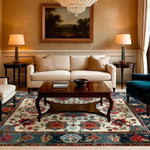 Elegant living room featuring a Sand and Sea Hand Knotted Area Rug with a vintage floral design. This Persian-inspired rug beautifully complements the classic decor, adding a touch of sophistication to the space. Ideal for large living rooms, the rug's intricate patterns and rich colors create a warm and inviting atmosphere.