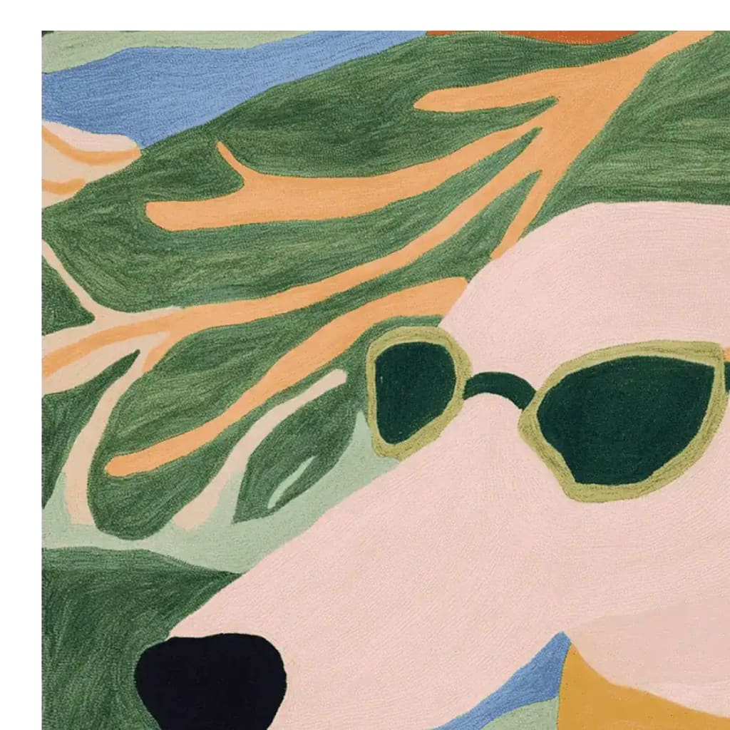 A stylish close-up of a hand-tufted area rug featuring an abstract design of a dog wearing sunglasses. The square rug showcases vibrant greens, blues, and soft pastel colors, perfect as a contemporary wool rug for your living room.