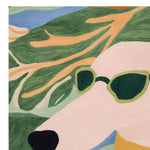 A stylish close-up of a hand-tufted area rug featuring an abstract design of a dog wearing sunglasses. The square rug showcases vibrant greens, blues, and soft pastel colors, perfect as a contemporary wool rug for your living room.