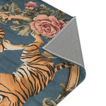 Folded corner showing golden tiger upper body with pink rose and green foliage on blue-grey background on the Savage Symphony Vintage Tapestry of Fierce Elegance