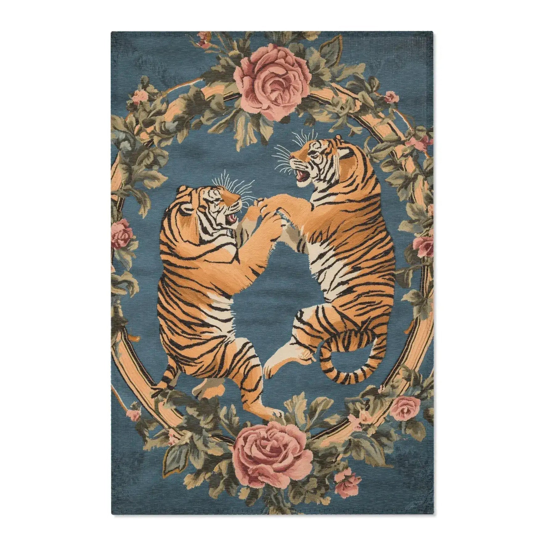 Full front view of two fighting golden tigers within pink rose and green leaf wreath on slate-blue background on the Savage Symphony Vintage Tapestry of Fierce Elegance