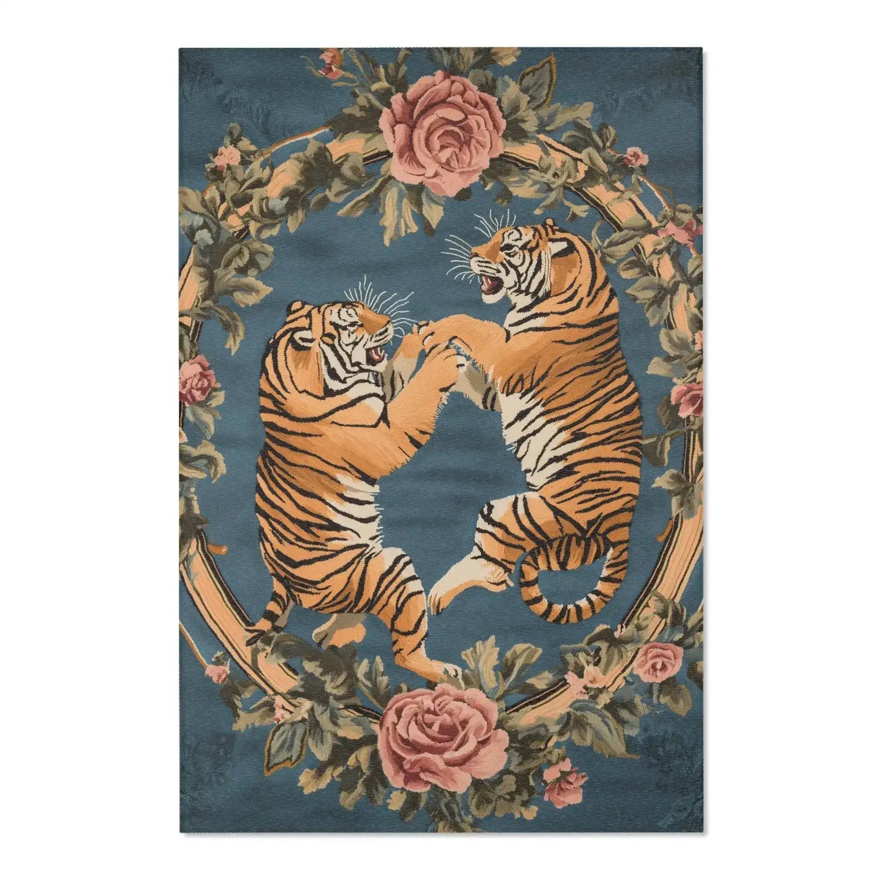 Full view of two golden tigers in combat framed by a rose and leaf floral wreath on dusty blue on the Savage Symphony Vintage Tapestry of Fierce Elegance