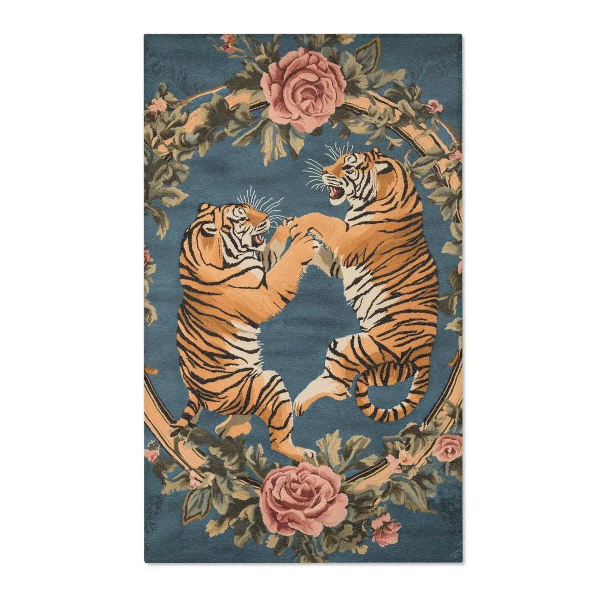 Two rearing golden tigers facing off within an oval wreath of pink roses and green leaves on slate-blue on the Savage Symphony Vintage Tapestry of Fierce Elegance