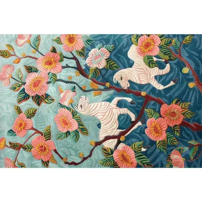 Vibrant Savanna Blossom Hand Tufted Area Rug featuring a stunning floral design with pink blossoms and playful white tigers against a rich blue background. Perfect for adding a touch of elegance to your living room, this 8x10 wool rug combines artistry with comfort.