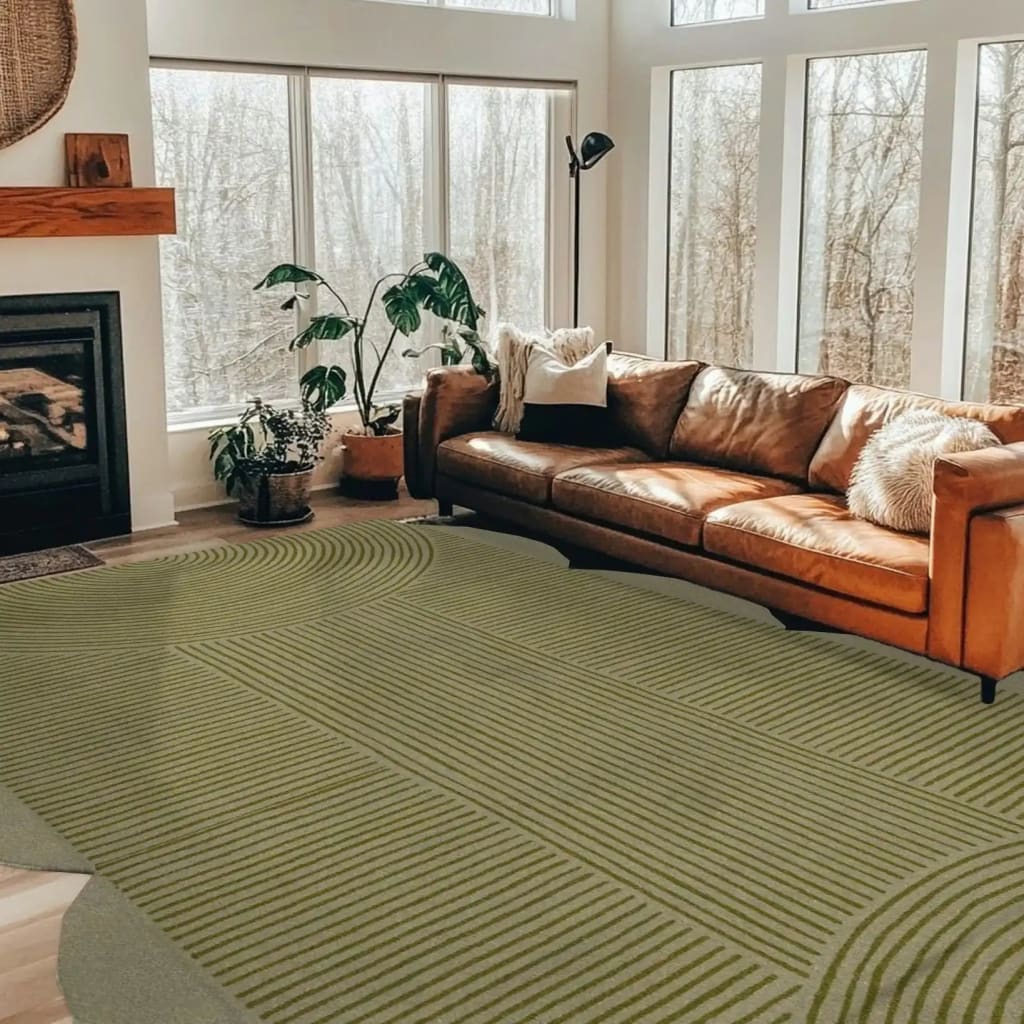 Stylish area rug in a modern living room setting, featuring a scallop arch geometric pattern. This hand-tufted wool rug adds a touch of elegance to the space, complemented by a cozy leather sofa and large windows. Perfect for those seeking large living room rugs that combine comfort and design.