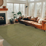 Stylish area rug in a modern living room setting, featuring a scallop arch geometric pattern. This hand-tufted wool rug adds a touch of elegance to the space, complemented by a cozy leather sofa and large windows. Perfect for those seeking large living room rugs that combine comfort and design.