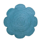 Top view of a blue scallop flower round area rug, crafted from jute. Perfect for enhancing dining rooms, large living rooms, and formal dining spaces with its elegant design.