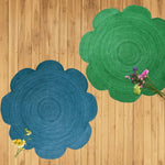 A stylish Scallop Flower Round Jute Rug in blue, perfect for adding charm to a dining room or large living room. This area rug features a unique scalloped design, ideal for both living rooms and formal dining room settings.