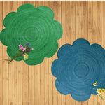 Top view of a Scallop Flower Round Jute Rug in green and blue, perfect for adding a natural touch to your living room. These large area rugs feature a unique scalloped design, ideal for any living room area. Enhance your space with these stylish living room rugs, available in 8x10 size.