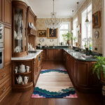 Scalloped Garden runner with cream field and teal-pink border down a traditional wood kitchen