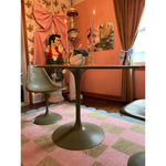 A stylish living room featuring a Scalloped Leaf Checker Pastel Hand Tufted Rug. This large area rug, perfect for a boho-inspired space, showcases a beautiful blend of pink and green checkered patterns with a scalloped border. The wool rug adds a cozy touch to the room, complementing the modern furniture and eclectic decor. Ideal for enhancing large living rooms with a touch of elegance and comfort.