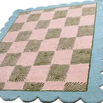 A stylish Scalloped Leaf Checker Pastel Hand Tufted Area Rug perfect for large living rooms. This boho wool rug showcases a unique checkerboard pattern with a mix of pastel colors and scalloped edges, making it an ideal large area rug for adding a cozy touch to any living room.