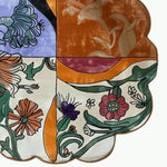 A vibrant, scalloped meadow hand-tufted round rug featuring an abstract floral design in various colors. This wool rug is perfect for adding a touch of elegance to large living rooms. Ideal as an 8x10 area rug, it combines artistic flair with practicality, making it a standout piece among large area rugs.